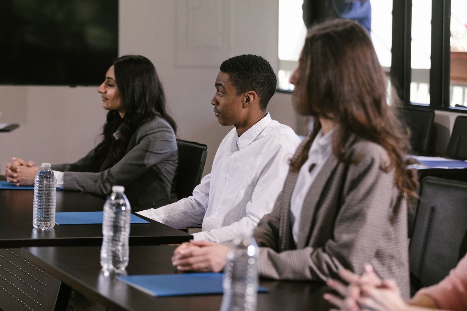 Diverse group of young people in a professional development workshop